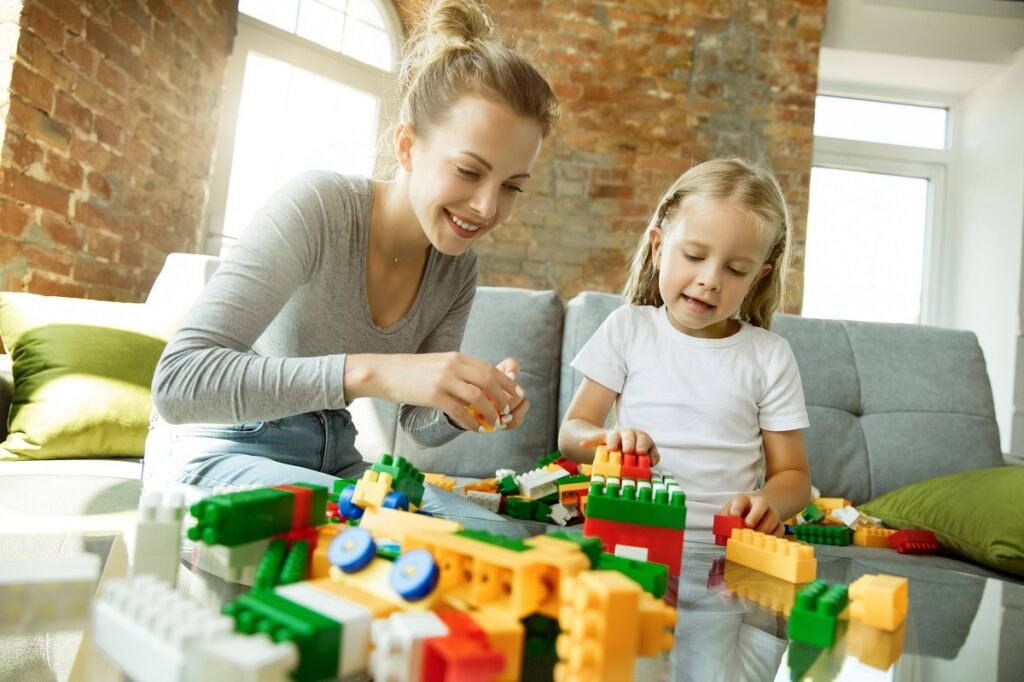 Development of motor skills in children: games that develop hand motor skills Female-caucasian-teacher-little-girl-mom-daughter